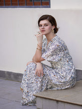A lady wears a silk dress